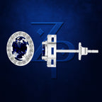A single stud earring shown in two views on a dark blue textured background: a front view with a halo of small clear stones around a deep blue oval center stone, and a side view showing the silver-toned post and back. The background includes a large stylized blue ZD logo.