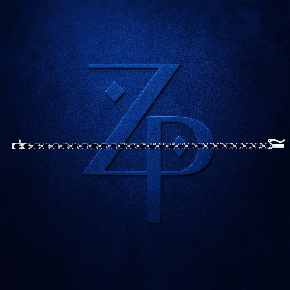 A close-up of a dark blue zipper with a large embossed stylized 'ZP' logo on a textured dark blue background.