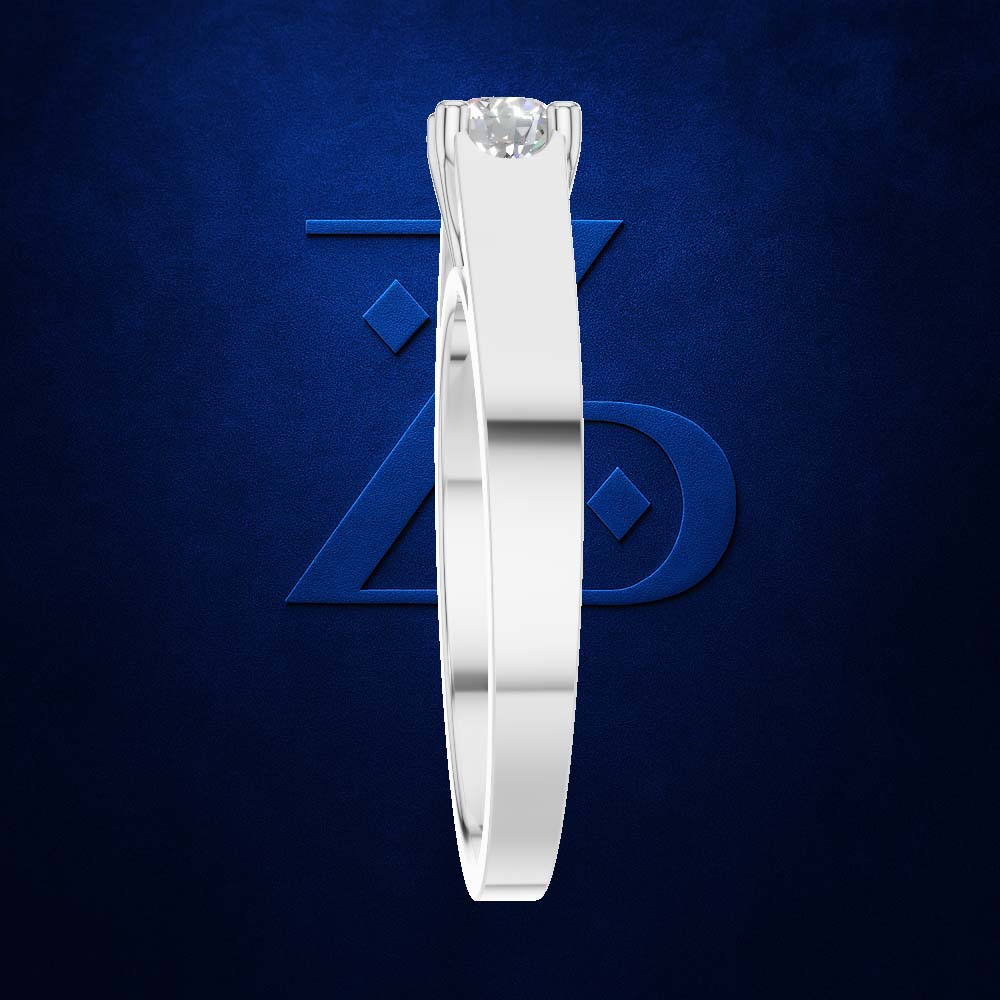 A white gold or platinum solitaire ring with a round brilliant-cut diamond, shown in a side profile view against a textured dark blue background with a subtle geometric logo.