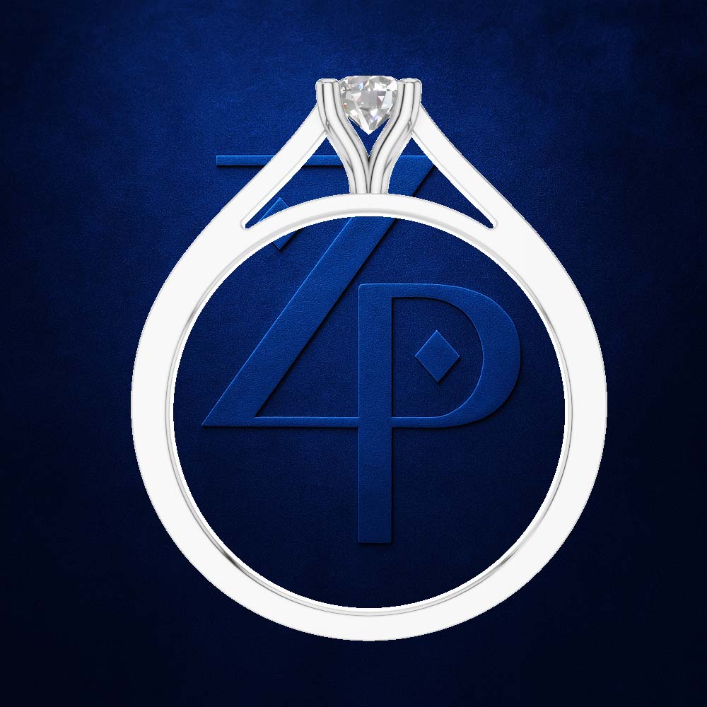 A white gold or platinum teardrop-shaped ring with a single round-cut gemstone at the top, displayed against a dark blue textured background featuring a stylized 'ZP' monogram.