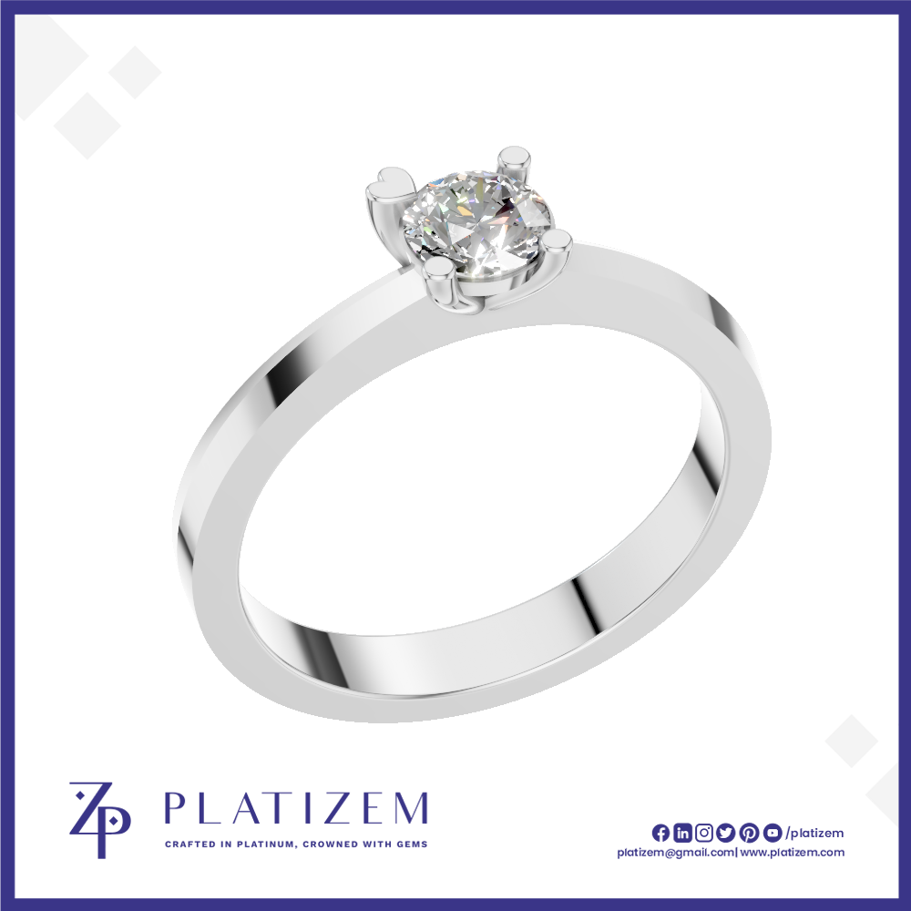 A classic solitaire engagement ring with a round brilliant-cut diamond set in a polished white gold or platinum band, presented on a white background with a blue border and the Platizem brand logo at the bottom.