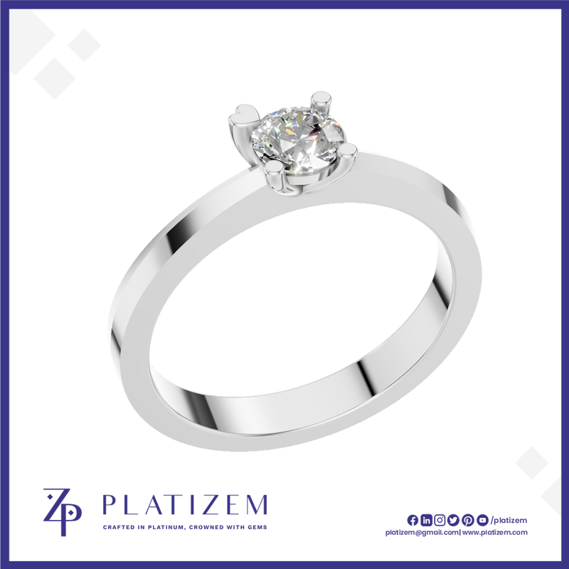 A classic solitaire engagement ring with a round brilliant-cut diamond set in a polished white gold or platinum band, presented on a white background with a blue border and the Platizem brand logo at the bottom.