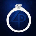 A silver-toned ring pendant with a clear gemstone at the top, featuring a circular blue insert with an embossed stylized '4P' monogram, shown on a dark blue textured background.