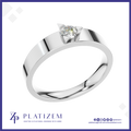A silver-toned solitaire ring with a round-cut clear gemstone in a prong setting, shown on a white background with the Platizem brand logo at the bottom.