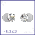 A pair of solitaire stud earrings with round brilliant-cut clear gemstones in a silver-toned setting, shown on a white background with the PLATIZEM brand logo at the bottom.