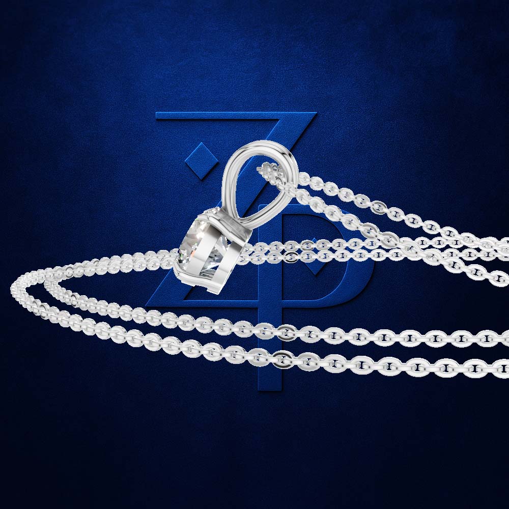 A silver-toned chain necklace with a large clear faceted gemstone pendant, arranged in a curved display on a dark blue textured background with a large blue monogram behind it.