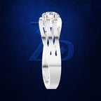 A silver-toned solitaire engagement ring with a round brilliant-cut diamond, shown floating against a textured dark blue background with a faint stylized logo.
