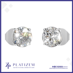 A pair of round-cut solitaire stud earrings in a silver-toned metal setting, shown on a white background with the brand name PLATIZEM at the bottom.