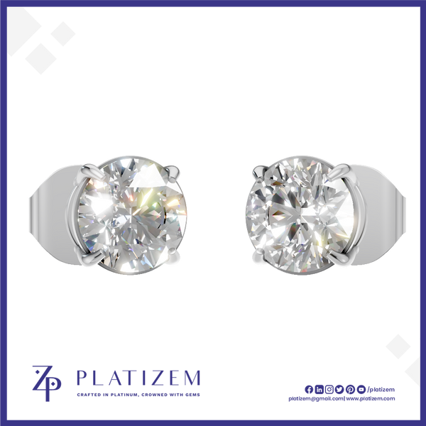 A pair of round-cut solitaire stud earrings in a silver-toned metal setting, shown on a white background with the brand name PLATIZEM at the bottom.