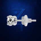 A close-up studio shot of a silver-toned stud earring with a clear faceted gemstone, shown from the back against a dark blue textured background with a subtle stylized logo.