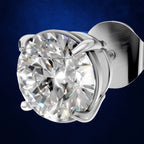 A single round brilliant-cut diamond stud earring in a polished silver-toned prong setting, shown against a dark blue gradient background.