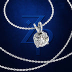 A silver-toned necklace with a round brilliant-cut clear gemstone pendant, arranged on a dark blue textured background with a large stylized 'Z' logo behind it.