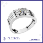 A silver-toned solitaire engagement ring with a round brilliant-cut diamond, presented on a white background with a blue border and the Platizem brand logo at the bottom.