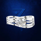 A silver ring with a large round clear gemstone, shown against a dark blue textured background with a large blue number 7 behind it. The gemstone is clear and does not contribute to the color mapping according to the schema rules for diamonds.