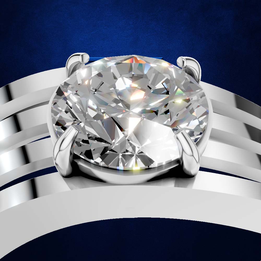 A close-up studio shot of a solitaire engagement ring featuring a large round brilliant-cut diamond set in a silver-colored metal band with multiple curved parallel prongs, against a dark blue textured background.