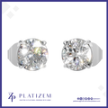 Two round-cut solitaire diamond stud earrings in a silver-tone prong setting, shown side by side on a white background with the PLATIZEM brand logo at the bottom.