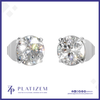 Two round-cut solitaire diamond stud earrings in a silver-tone prong setting, shown side by side on a white background with the PLATIZEM brand logo at the bottom.
