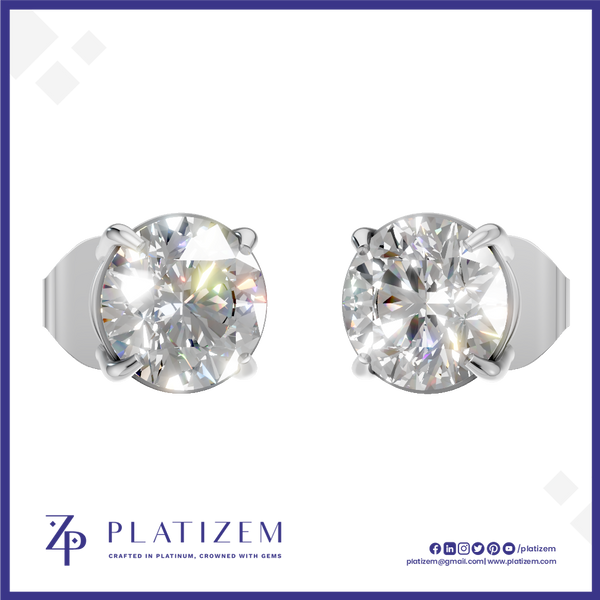 Two round-cut solitaire diamond stud earrings in a silver-tone prong setting, shown side by side on a white background with the PLATIZEM brand logo at the bottom.