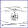 A round brilliant-cut clear gemstone solitaire pendant in a silver-toned setting, suspended on a delicate silver chain against a white background with a blue border and Platizem branding.