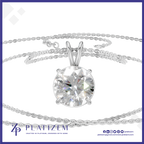 A round brilliant-cut clear gemstone solitaire pendant in a silver-toned setting, suspended on a delicate silver chain against a white background with a blue border and Platizem branding.