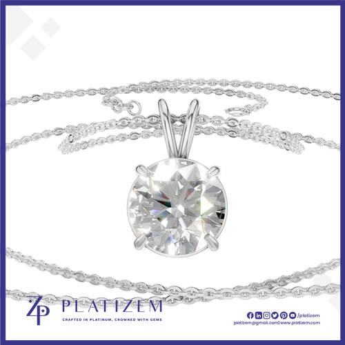 A round brilliant-cut clear gemstone solitaire pendant in a silver-toned setting, suspended on a delicate silver chain against a white background with a blue border and Platizem branding.
