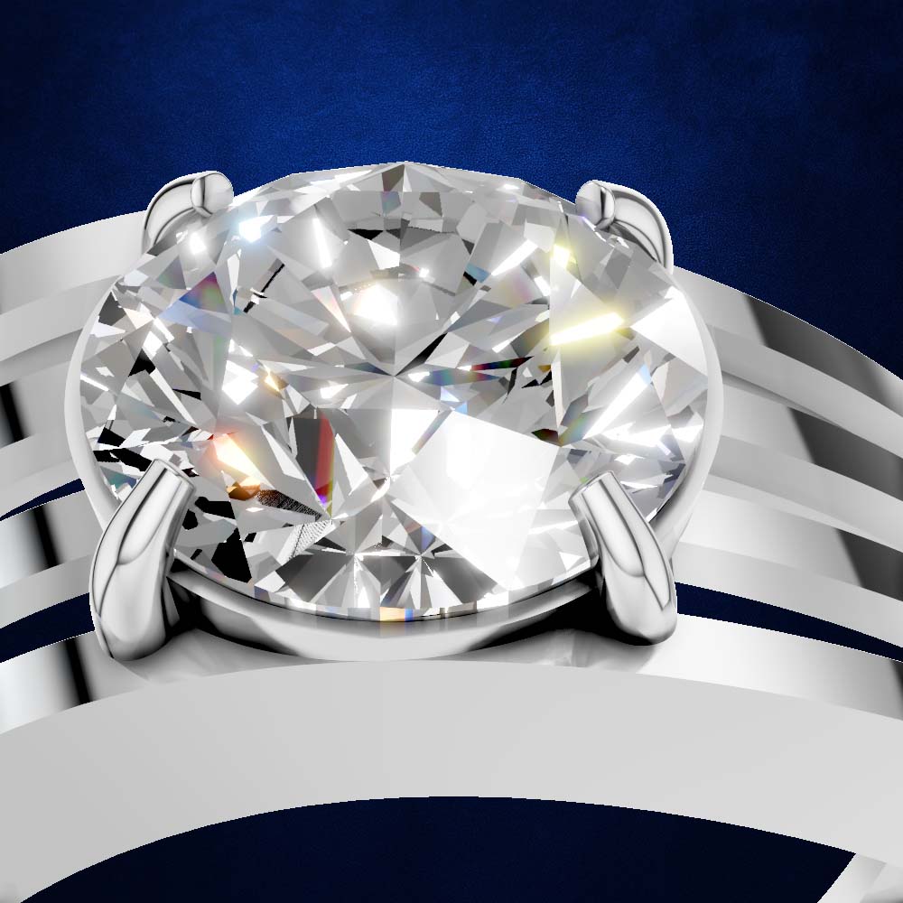 A close-up studio shot of a solitaire engagement ring featuring a large round brilliant-cut diamond set in a polished silver-colored band with a split shank design, set against a dark blue textured background.