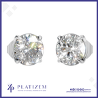 A pair of round-cut diamond stud earrings in a silver four-prong setting, displayed on a white background with a blue border. The brand name 'PLATIZEM' is visible at the bottom.