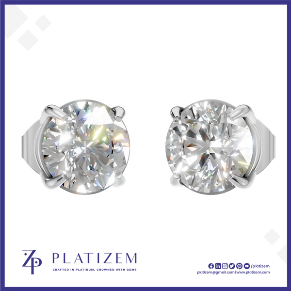 A pair of round-cut diamond stud earrings in a silver four-prong setting, displayed on a white background with a blue border. The brand name 'PLATIZEM' is visible at the bottom.
