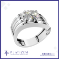 A platinum solitaire engagement ring featuring a round brilliant-cut diamond set in a four-prong setting, mounted on a polished three-strip band. The ring is presented on a white background with a blue border, and the brand name 'PLATIZEM' is visible at the bottom.