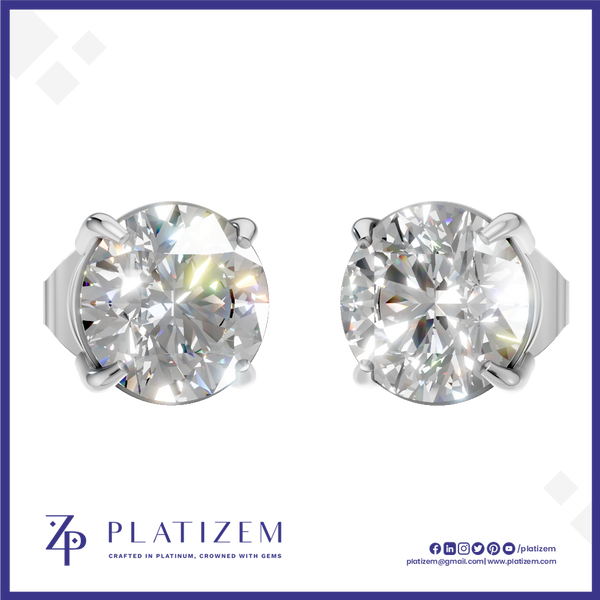 A pair of round brilliant-cut diamond stud earrings in a silver four-prong setting, displayed on a white background with a blue border. The brand name 'PLATIZEM' is visible at the bottom.