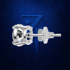A single silver stud earring with a clear gemstone in a prong setting, shown from the side against a dark textured blue background with a subtle stylized 'Z' logo.