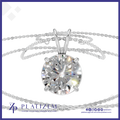 A round-cut diamond solitaire pendant necklace in a silver-toned setting with a matching chain, shown on a white background with a blue border and Platizem branding at the bottom.