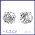 A pair of round-cut diamond stud earrings in a silver-toned prong setting, displayed on a white background with a blue border. The brand name 'PLATIZEM' is visible at the bottom.