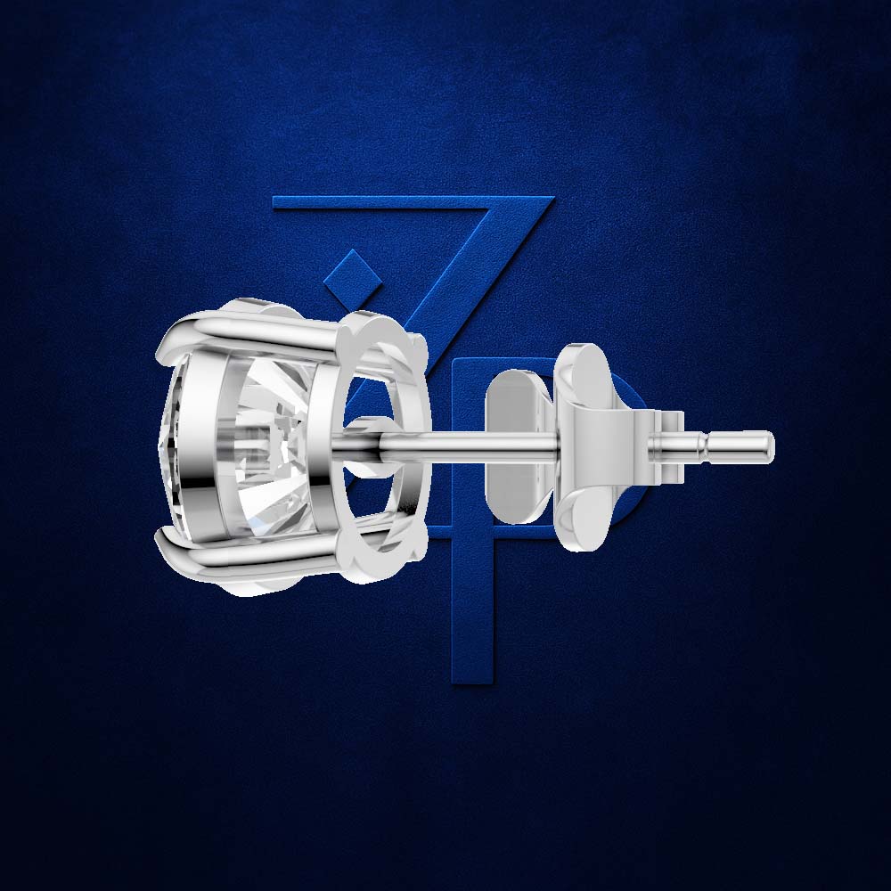 A polished silver-toned stud earring with a bezel-set clear gemstone and matching post/backings, shown against a dark blue textured background with a subtle blue geometric logo behind it.
