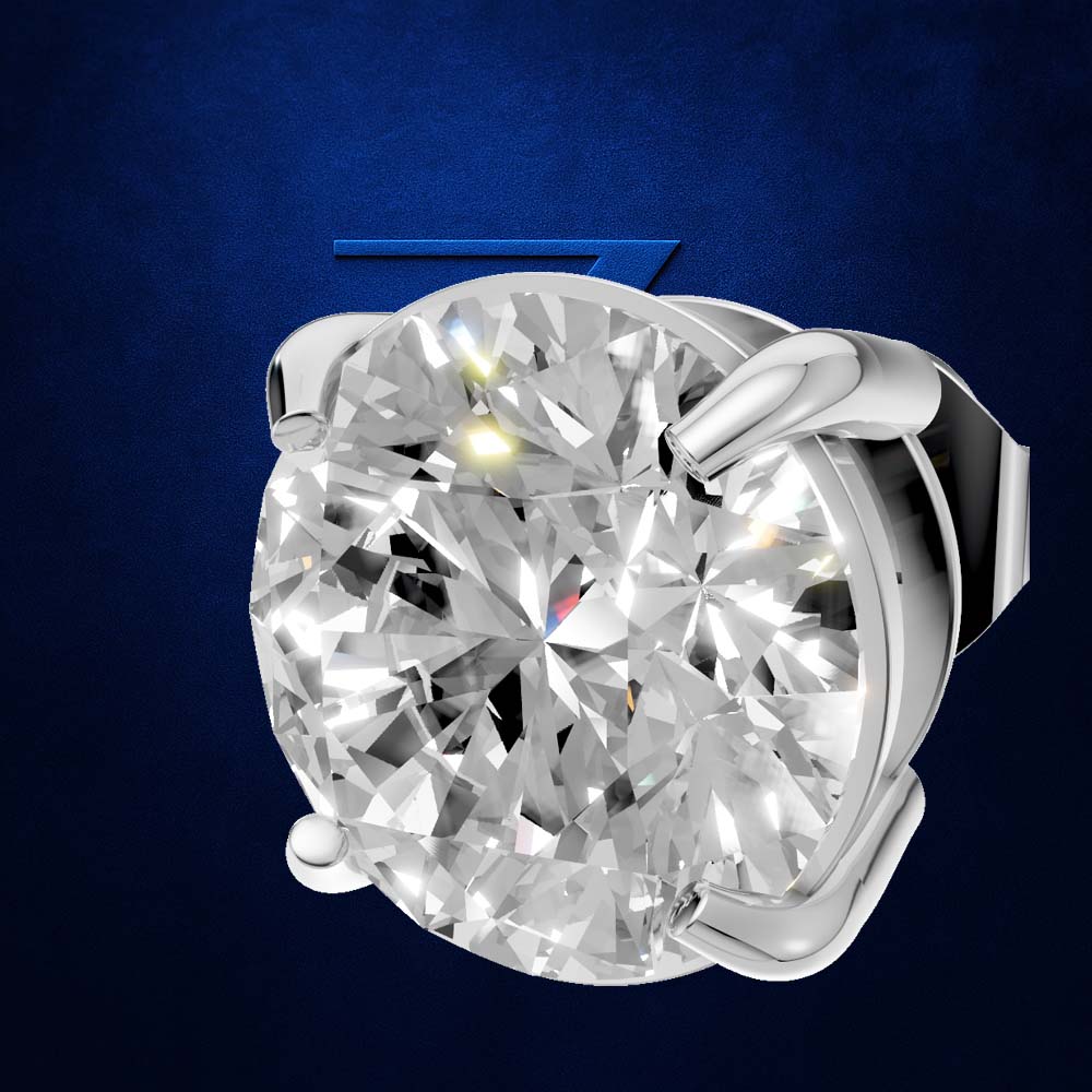 A round brilliant-cut diamond solitaire setting in a polished silver-colored metal, shown against a textured dark blue background.