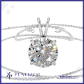A round brilliant-cut diamond solitaire pendant in a silver four-prong setting, shown with a delicate silver chain on a white background with a blue border. The brand name 'PLATIZEM' is visible at the bottom.