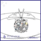 A round brilliant-cut diamond solitaire pendant in a silver four-prong setting, shown with a delicate silver chain on a white background with a blue border. The brand name 'PLATIZEM' is visible at the bottom.