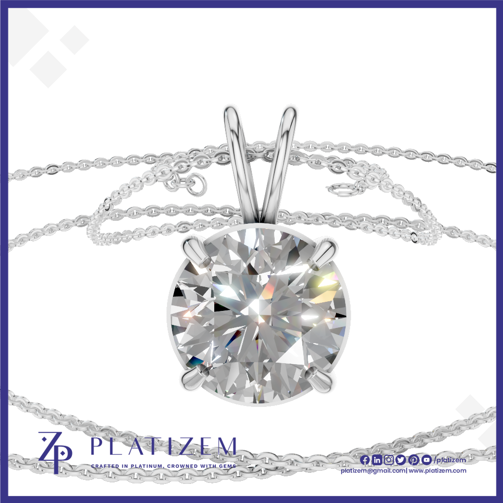 A round brilliant-cut diamond solitaire pendant in a silver four-prong setting, shown with a delicate silver chain on a white background with a blue border. The brand name 'PLATIZEM' is visible at the bottom.