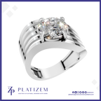 A silver-toned solitaire engagement ring with a round brilliant-cut diamond, presented on a white background with a blue border and the Platizem brand logo at the bottom.