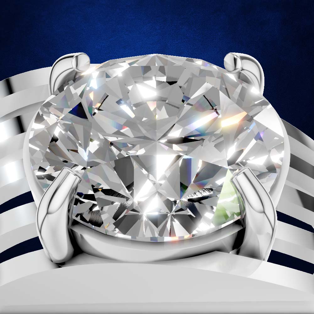 A close-up studio shot of a solitaire diamond ring with a large oval-cut clear gemstone in a polished silver-toned setting, shown against a dark blue background with white curved decorative elements.