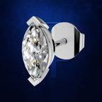 A single marquise-cut diamond stud earring in a polished silver-toned setting, shown at an angle with the post and backing visible against a dark blue textured background.