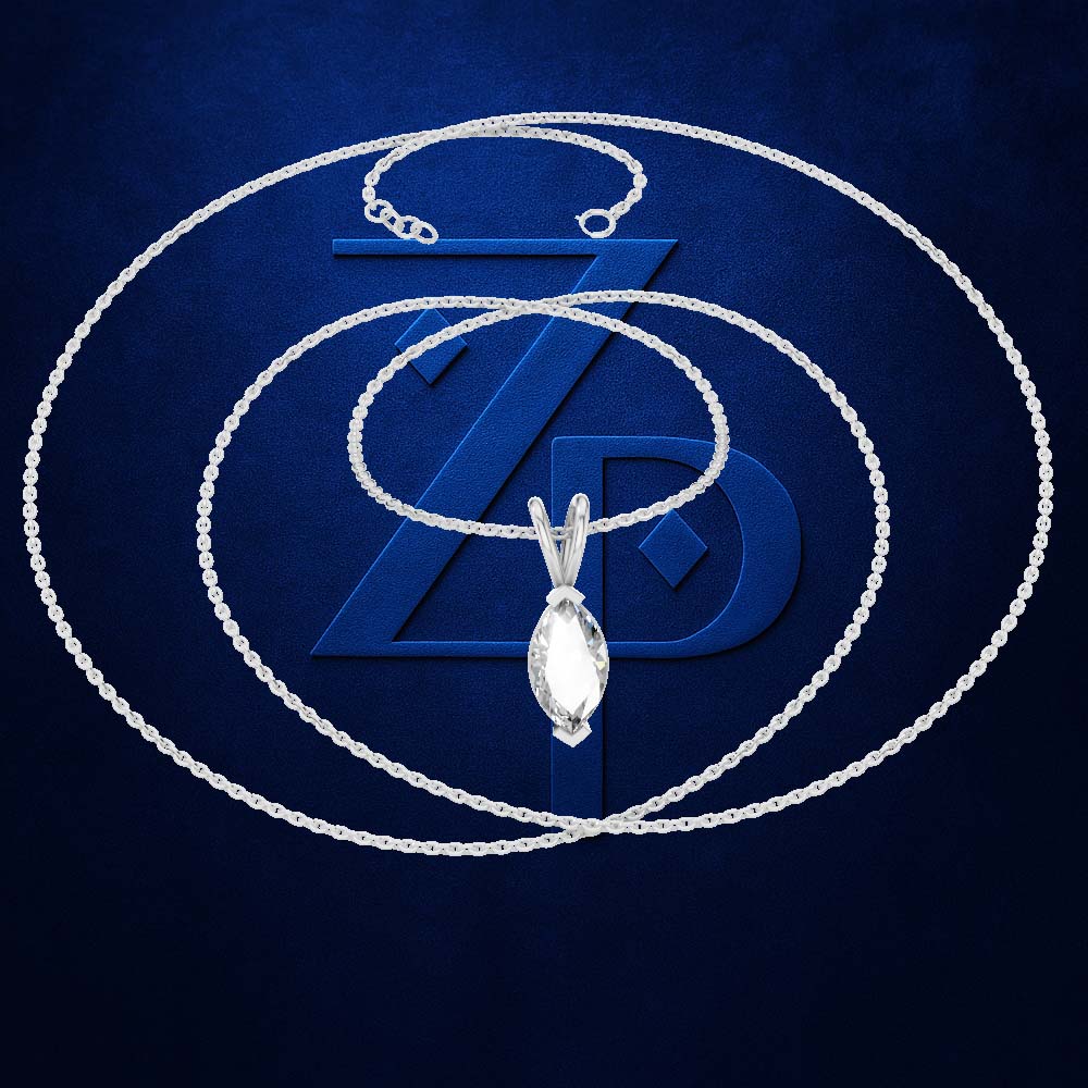 A silver-toned chain necklace with a marquise-cut clear gemstone pendant, arranged in concentric circles over a dark blue textured background with a large stylized blue ZD logo.