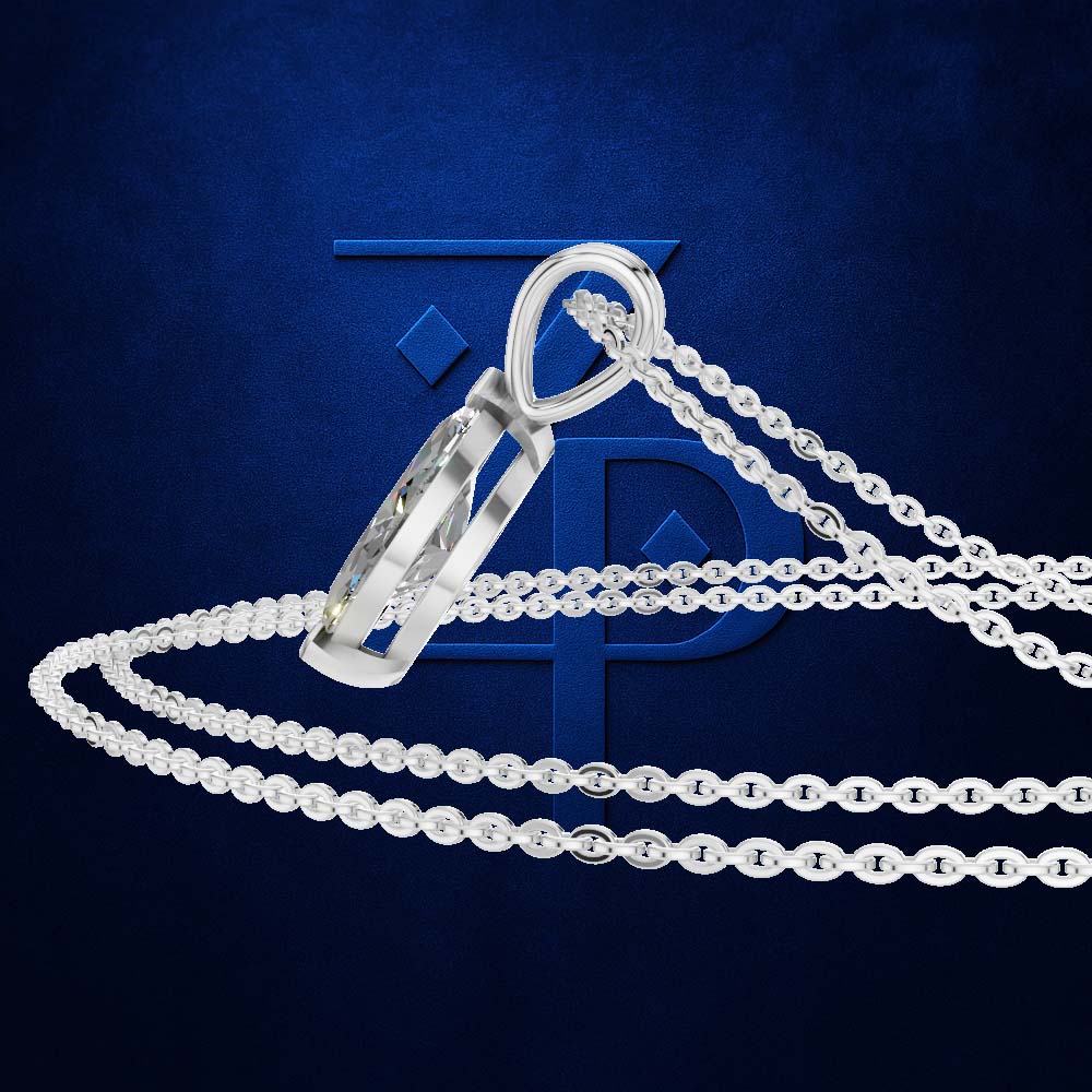A silver-toned cremation urn pendant with a faceted crystal-like front, shown on a matching chain against a dark blue textured background with a large stylized blue monogram behind it.