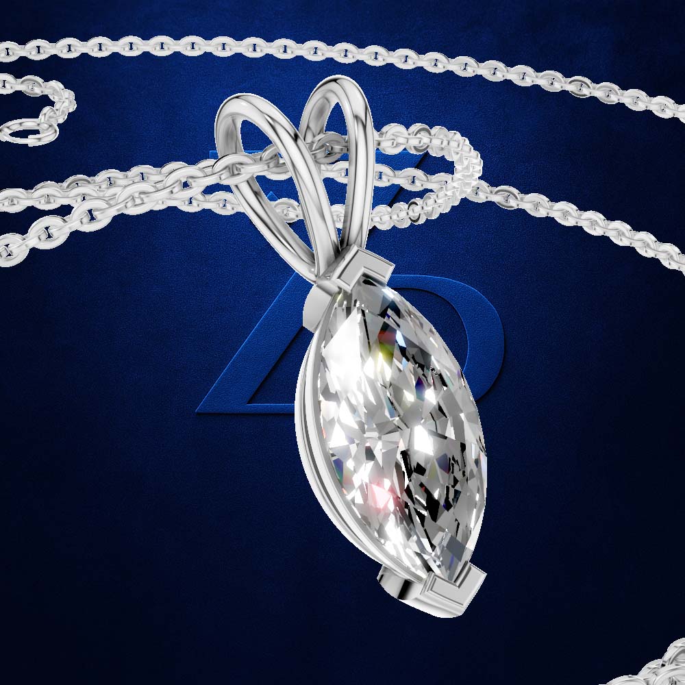 A silver-tone pendant necklace with a marquise-cut clear gemstone, shown against a dark blue background with chain details.