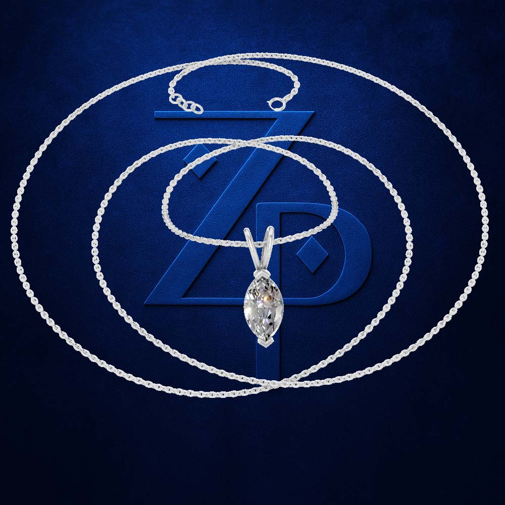 A silver-tone chain necklace with a marquise-cut diamond pendant, displayed against a dark blue textured background with a large stylized 'ZD' logo behind it.