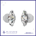 A pair of round brilliant-cut diamond stud earrings set in silver-toned metal, displayed on a white background with a blue border and the Platizem brand logo at the bottom.