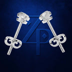 A pair of silver-toned stud earrings with decorative scrollwork key-shaped backings, displayed against a dark blue textured background with a large blue monogram logo behind them.