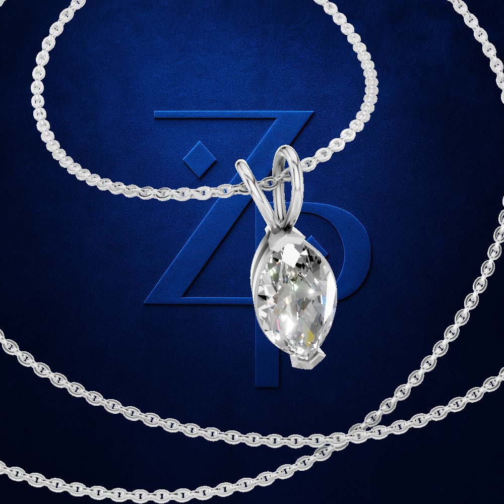 A silver-toned necklace with a marquise-cut clear gemstone pendant, displayed on a textured dark blue background with a large stylized 'ZP' logo behind it.