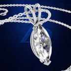 A silver-tone pendant necklace featuring a large, faceted marquise-cut clear gemstone, displayed on a dark blue textured background with a matching silver chain.