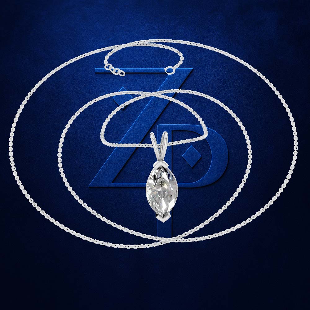 A silver-tone chain necklace with a teardrop-shaped marquise-cut clear gemstone pendant, displayed against a dark blue textured background with a large stylized blue 'ZD' logo behind it.